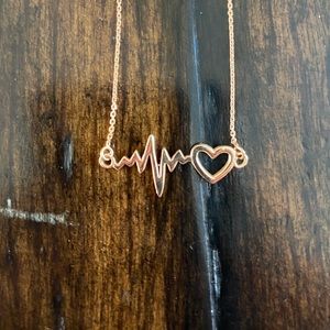 Heartbeat with heart necklace